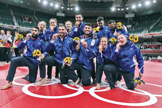  ISRAEL’S JUDO team poses with their bronze medals at the 2020 Summer Olympics in Tokyo.  (credit: JACK GUEZ/AFP VIA GETTY IMAGES)