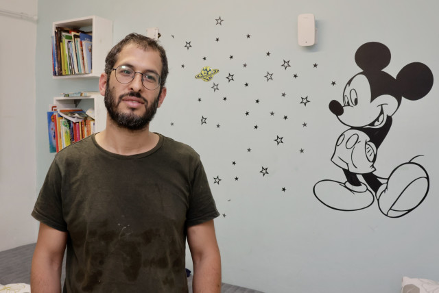  Ishai Trabelsi stands in the safe room of his Sderot home amid the risk of rockets fired by Palestinian Islamic Jihad during Operation Shield and Arrow, May 11, 2023. (credit: MARC ISRAEL SELLEM/THE JERUSALEM POST)