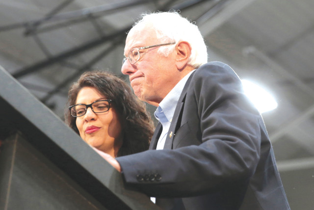  SEN. BERNIE SANDERS and Rep. Rashida Tlaib address a Sanders presidential campaign rally in Detroit in 2019. Last week, Sanders allowed Tlaib to host a ‘Nakba’ event on Capitol Hill (credit: REBECCA COOK/REUTERS)