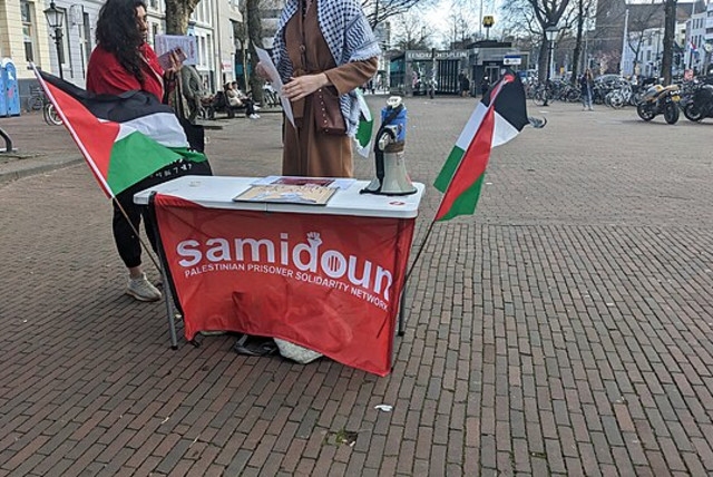  A Samidoun stand with Palestinian flags is seen in Rotterdam, Netherlands on March 28, 2023 (credit: VIA WIKIMEDIA COMMONS)