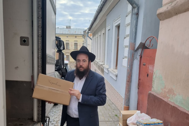  A Ukrainian rabbi receives a delivery of dairy products for his community ahead of Shavuot. (credit: JRNU)