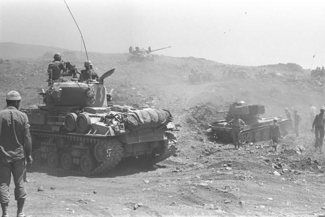  Israeli tanks advancing on the Golan Heights, June 10, 1967 (credit: Assaf Kutin/GPO via Wikimedia Commons)