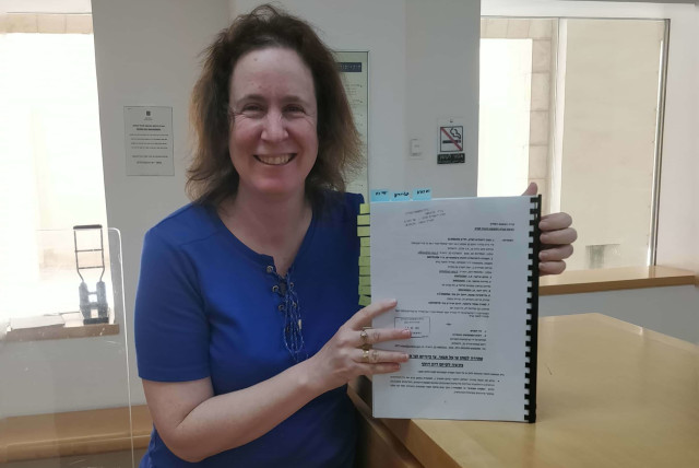  Jerusalem Institute of Justice attorney Tamar Stachel Devor submitting the petition against the passport plan to the High Court of Justice on Thursday (credit: JERUSALEM INSTITUTE OF JUSTICE)