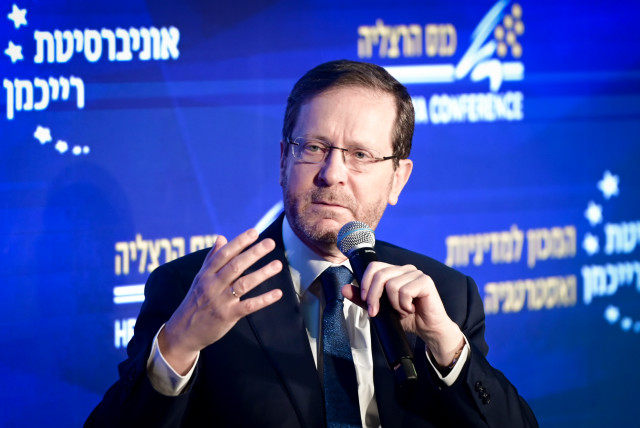  Israeli President Isaac Herzog is seen speaking at a conference at Reichman University in Herzliya, on May 22, 2023. (credit: AVSHALOM SASSONI/FLASH90)