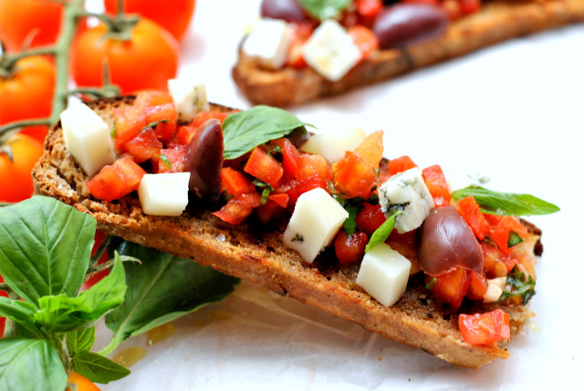  BRUSCHETTA WITH TOMATOES, BASIL AND SALTY CHEESE (credit: PASCALE PEREZ-RUBIN)