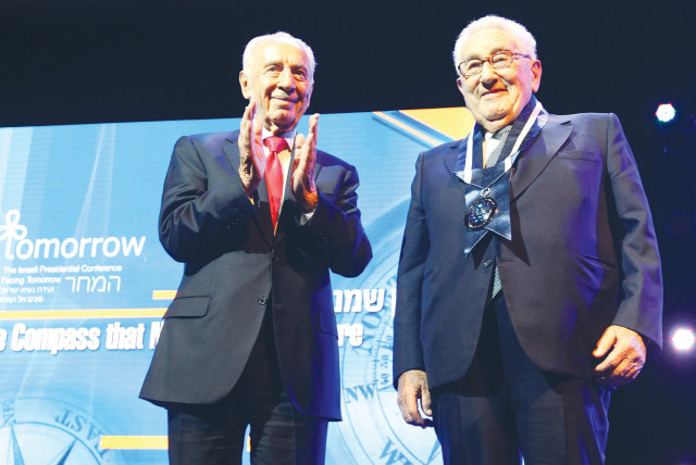  THEN-PRESIDENT Shimon Peres awards Henry Kissinger with Israel’s Presidential Award of Distinction, in Jerusalem, in 2012.  (photo credit: MIRIAM ALSTER/FLASH90)