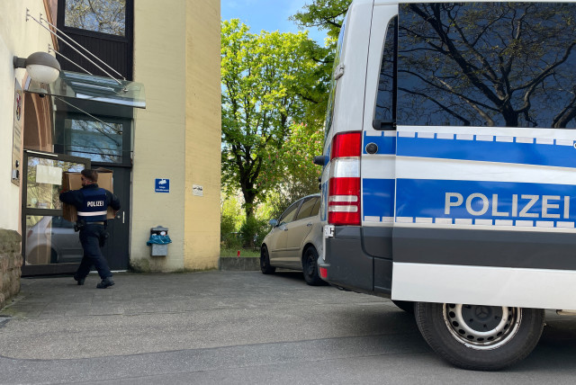 Police officers carry boxes into a police building in Mainz, Germany, May 3, 2023, after German police arrested dozens of people across the country on Wednesday in an investigation of the Italian 'Ndrangheta organised crime group, German public prosecutors and state police said. (photo credit: REUTERS/Timm Reichert)