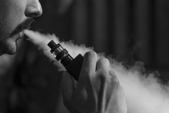  A person is seen vaping (Illustrative). (credit: PIXABAY)