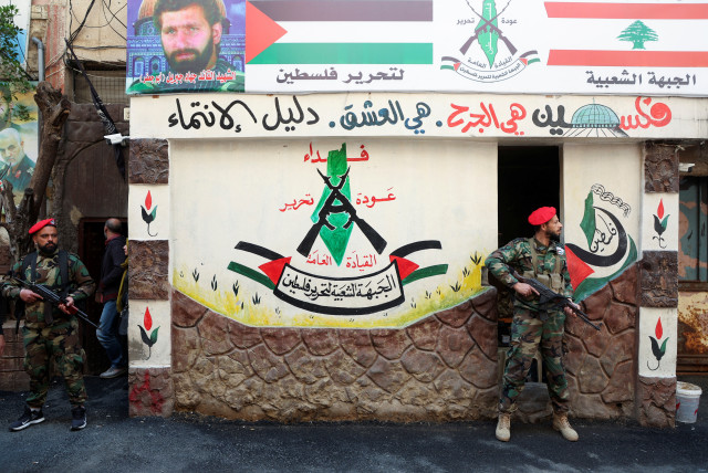  Members of the Popular Front for the Liberation of Palestine-General Command (PFLP-GC) stand guard during a parade marking the annual al-Quds Day, (Jerusalem Day), at Burj al-Barajneh Palestinian refugee camp in Beirut, Lebanon April 14, 2023. (credit: REUTERS/MOHAMED AZAKIR)