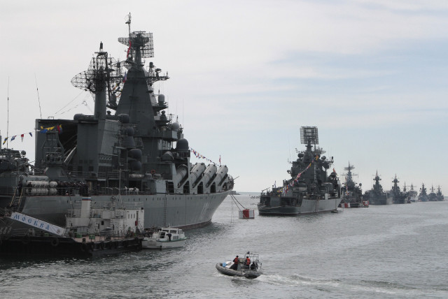  Russian Navy vessels are anchored in a bay of the Black Sea port of Sevastopol in Crimea May 8, 2014. Russian servicemen and sailors will conduct a parade to mark Victory Day on May 9, according to local media. (credit: STRINGER/ REUTERS)
