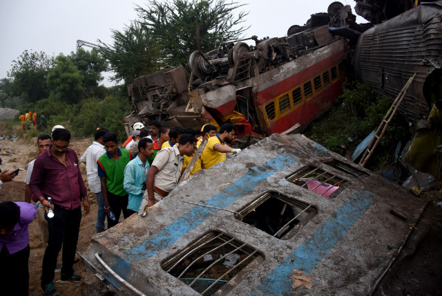  Rescue workers search for survivors after two passenger trains collided in Balasore district in the eastern state of Odisha, India, June 3, 2023. (credit: REUTERS/STRINGER)