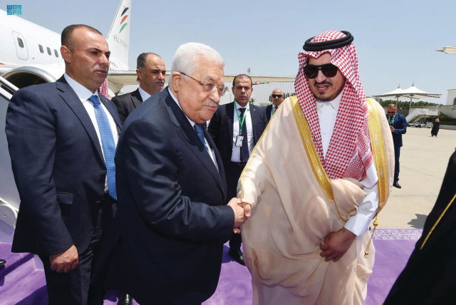  PALESTINIAN AUTHORITY head Mahmoud Abbas is received by Prince Badr Bin Sultan, as he arrives to attend the Arab League Summit in Jeddah, last month. (credit: SAUDI PRESS AGENCY/REUTERS)