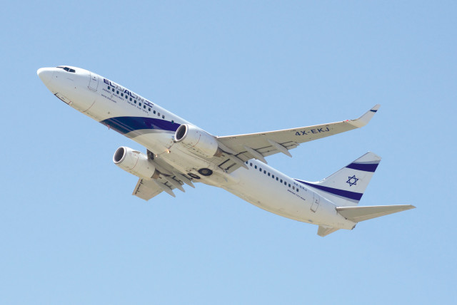  An Israeli El Al plane flying above the clouds. (credit: Norbert/Pixabay)