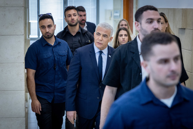  Head of opposition Yair Lapid arrives to testify in the trial against Israeli prime minister Benjamin Netanyahu at the District Court in Jerusalem on June 12, 2023. (credit: YONATAN SINDEL/FLASH90)
