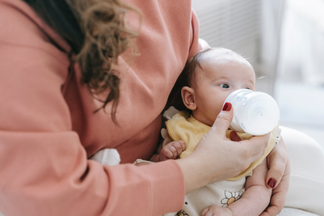 Illustrative image of a baby drinking from a bottle. (credit: PEXELS)