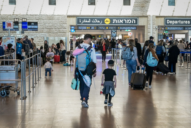  Travelers are seen at the departure hall of the Ben Gurion International Airport on April 4, 2023 (credit: AVSHALOM SASSONI/FLASH90)