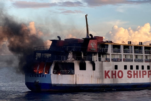  Smoke rises due to a massive fire at a ferry in Bohol, Philippines, June 18, 2023 in this handout image. (credit: PHILIPPINE COAST GUARD/HANDOUT VIA REUTERS)