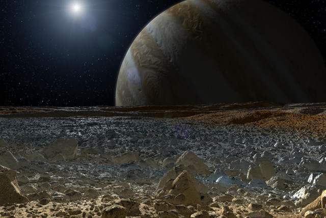  This artist's concept shows a simulated view from the surface of Jupiter's moon Europa. Europa's potentially rough, icy surface, tinged with reddish areas that scientists hope to learn more about, can be seen in the foreground. (credit: NASA/JPL-Caltech)