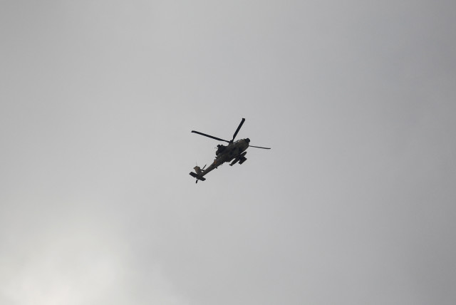 A helicopter flies during an Israeli raid in Jenin, in the West Bank June 19, 2023. (credit: REUTERS/RANEEN SAWAFTA)