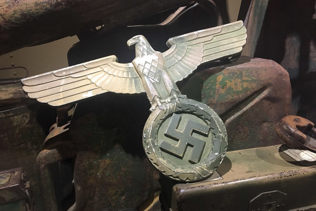  A Nazi eagle wall decoration at the Dead Man's Corner Museum in France. (credit: Wikimedia Commons)