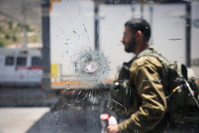 The scene of a deadly shooting attack near the Jewish Settlement of Eli, West Bank, June 21, 2023 (credit: YONATAN SINDEL/FLASH90)