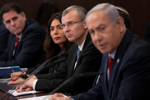  Prime Minister Benjamin Netanyahu and Justice Miniser Yariv Levin attend a weekly cabinet meeting in the prime minister's office in Jerusalem, June 18, 2023 (credit: Ohad Zwigenberg/Pool via REUTERS)