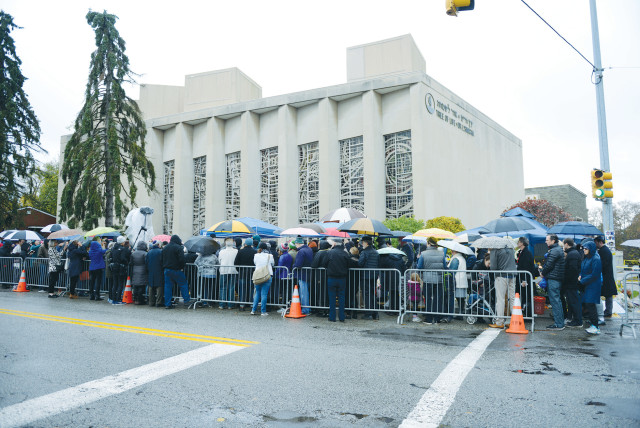  A CROWD attends a vigil outside the Tree of Life synagogue, marking one week after the deadly shooting there, in Pittsburgh, in 2018.  (credit: ALAN FREED/REUTERS)