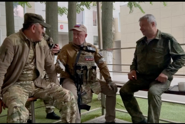  Founder of Wagner private mercenary group Yevgeny Prigozhin speaks with Russia's Deputy Minister of Defense Yunus-Bek Yevkurov, at the headquarters of the Southern Military District of the Russian Armed Forces in Rostov-on-Don, Russia, in this screen grab from a video released on June 24, 2023. (credit: VIA REUTERS)