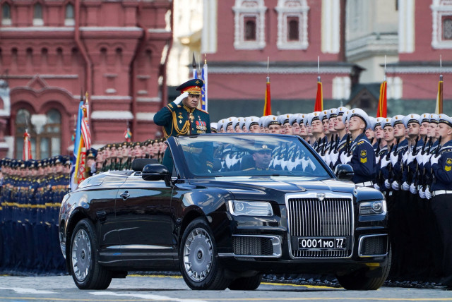 Russian Defence Minister Sergei Shoigu drives an Aurus cabriolet during a military parade on Victory Day, which marks the 78th anniversary of the victory over Nazi Germany in World War Two, in Red Square in central Moscow, Russia May 9, 2023. (credit: Pelagiya Tikhonova/Moscow News Agency/Handout via REUTERS)