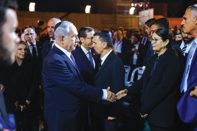 PRIME MINISTER Benjamin Netanyahu shakes hands with Supreme Court President Esther Hayut on Holocaust Remembrance Day at Yad Vashem. (credit: ERIK MARMOR/FLASH90)