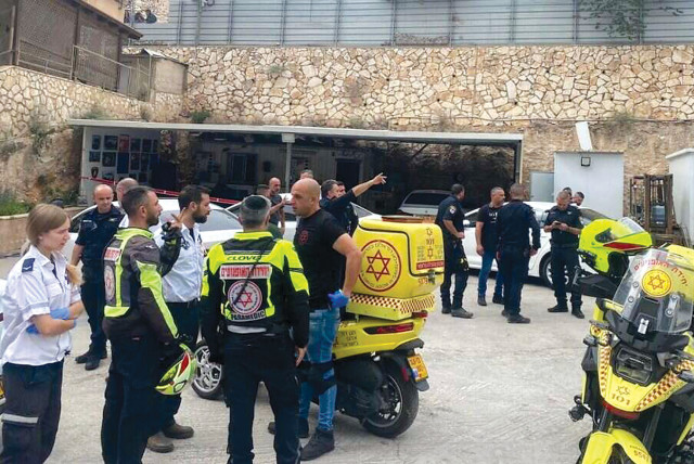  The scene outside a car wash in Jaffa of Nazareth, where five Arab Israelis were gunned down in a gang war on June 8. (credit: MDA/MAARIV)