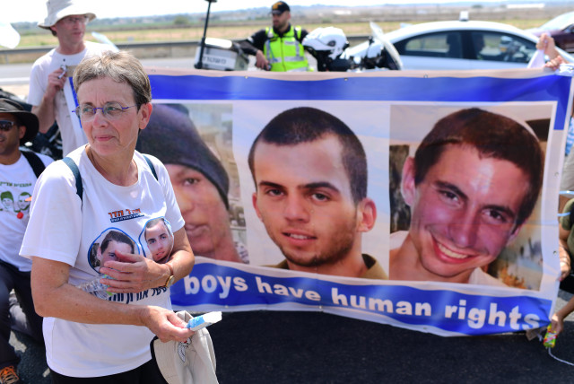  Friends, family and activists hold a protest march calling for the return of killed Israeli soldiers Oron Shaul, Hadar Goldin and captive Israeli citizen Avera Mengistu near Ashdod, August 5, 2022 (credit: TOMER NEUBERG/FLASH90)