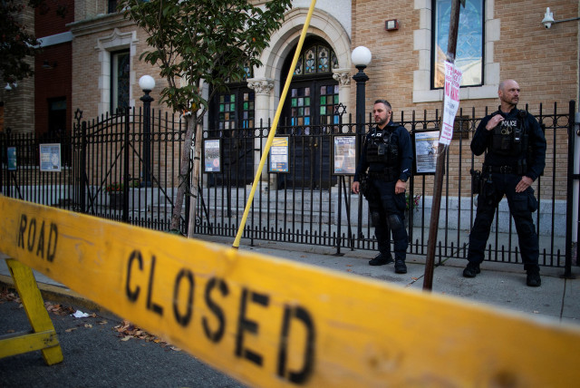 IN A scene repeated across America, police stand guard in front of the United Synagogue of Hoboken, New Jersey, 2022. (credit: Eduardo Munoz/Reuters)