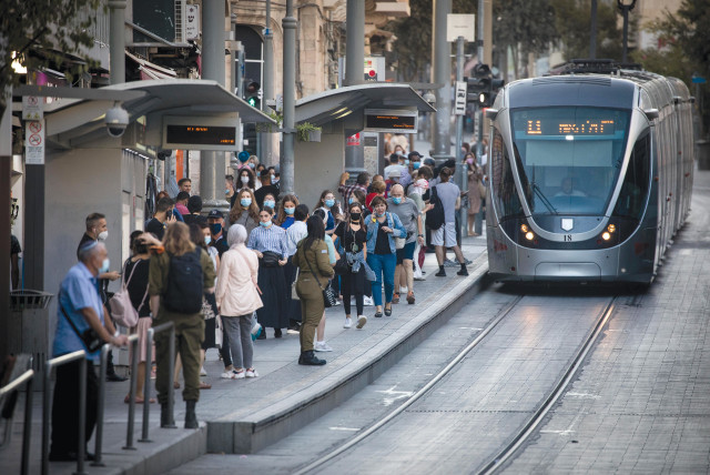  EVERY PASSENGER is a story on the Jerusalem light rail.  (photo credit: YONATAN SINDEL/FLASH90)