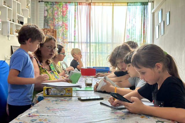  7-year-old Oksana (R) and other Russian and Ukrainian children are cared for in Lena Dubrovin's home, June 21, 2023.  (credit: DARIO SANCHEZ/THE MEDIA LINE)