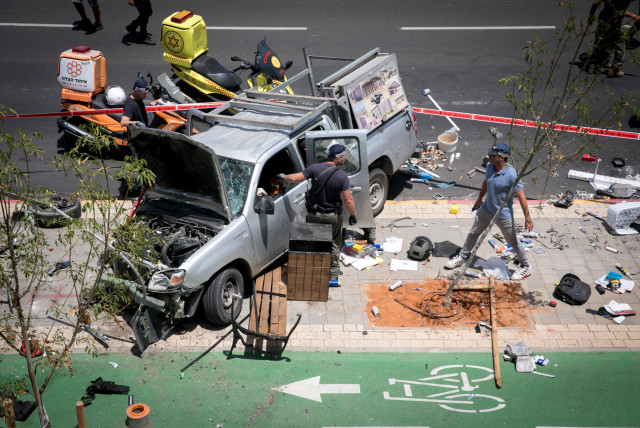  Police and rescue forces at the scene of a car ramming terror attack in north Tel Aviv on June 4, 2023. (credit: MIRIAM ALSTER/FLASH90)