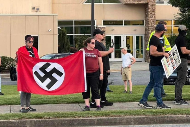  Neo-Nazis wave swastika flags outside of Georgia synagogue this past June  (credit: Jenifer Caron Derrick, Facebook)