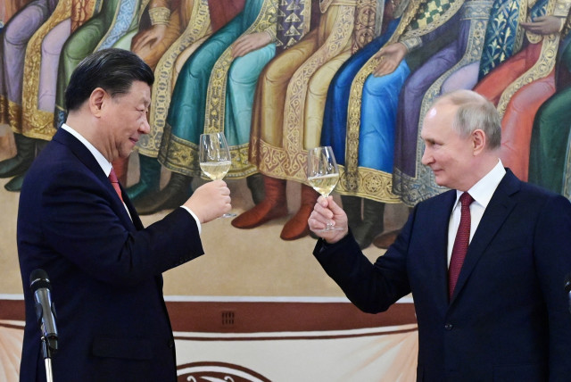  Russian President Vladimir Putin and Chinese President Xi Jinping attend a reception at the Kremlin in Moscow, Russia March 21, 2023.  (credit: Sputnik/Pavel Byrkin/Kremlin via REUTERS)