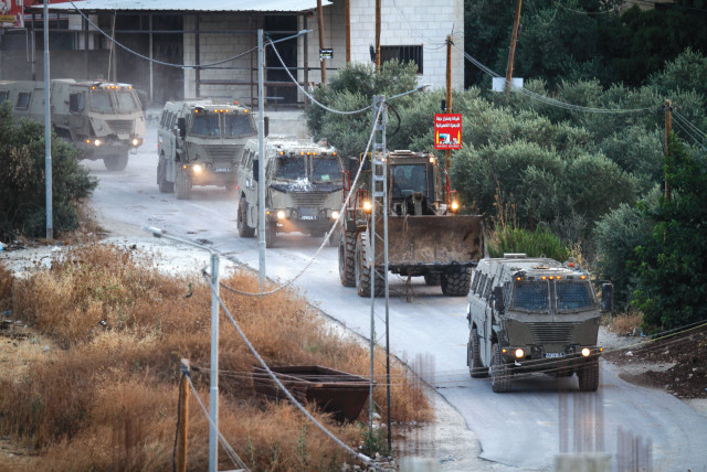 ISRAELI ARMY vehicles drive through Jenin, on Tuesday. There is no military solution to the Israeli-Palestinian conflict, says the writer (photo credit: NASSER ISHTAYEH/FLASH90)