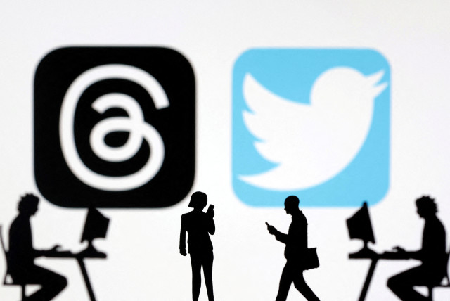 Meta Threads and Twitter app logos are seen in this illustration taken, July 6, 2023. (credit: REUTERS/DADO RUVIC/ILLUSTRATION/FILE PHOTO)