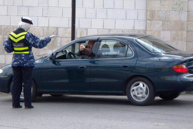  A female police officer in Amman. (credit: Wikimedia Commons)