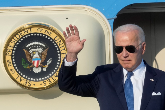  US President Joe Biden waves from the stairs of Air Force One as he arrives at Vilnius airport on the eve of a NATO leaders summit, Lithuania, July 10, 2023. (credit: Ints Kalnins/Reuters)