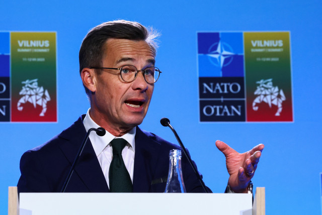 Swedish Prime Minister Ulf Kristersson speaks to the press after his meeting with Turkish President Tayyip Erdogan and NATO Secretary-General Jens Stoltenberg, on the eve of a NATO summit, in Vilnius, Lithuania July 10, 2023. (credit: YVES HERMAN/REUTERS)
