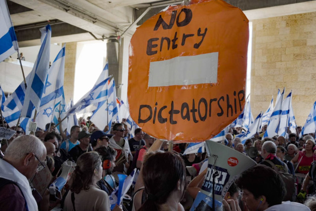  ''No entry dictatorship'' sign at Ben Gurion airport during the protests on July 11, 2023. (credit: CHEN LEOPOLD)