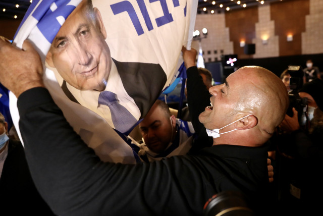  Itzik Zarka celebrates victory with fellow Likud members. (credit: MARC ISRAEL SELLEM)