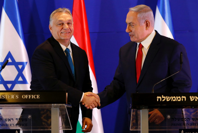  Hungarian Prime Minister Viktor Orban and Israeli Prime Minister Benjamin Netanyahu shake hands after their meeting in Jerusalem February 19, 2019. (credit: ARIEL SCHALIT/POOL VIA REUTERS)