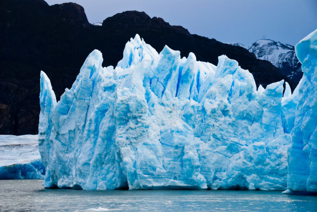  Icebergs floating on water. (credit: PEXELS)