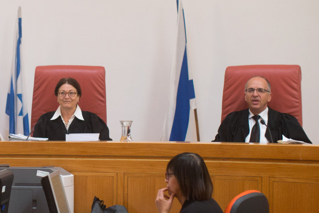 Supreme Court Justice Esther Hayut sits with Supreme Court Justice Noam Sohlberg during a court hearing. (credit: YONATAN SINDEL/FLASH90)