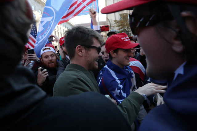 Supporters of the America First ideology and U.S. President Donald Trump cheer on Nick Fuentes, a leader of the America First movement and a white nationalist, as he makes his way through the crowd for a speech during the ''Stop the Steal'' and ''Million MAGA March'' protests after the 2020 U.S. presid (credit: REUTERS/LEAH MILLIS)