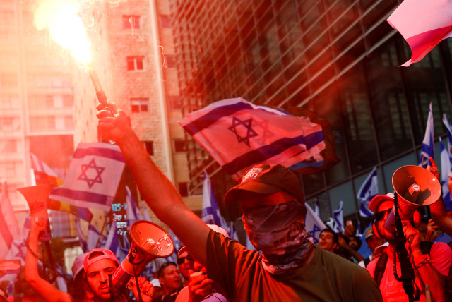 People demonstrate on the 'Day of National Resistance' in protest against Israeli Prime Minister Benjamin Netanyahu and his nationalist coalition government's judicial reform, in Tel Aviv, Israel July 18, 2023.  (credit: CORINNA KERN/REUTERS)